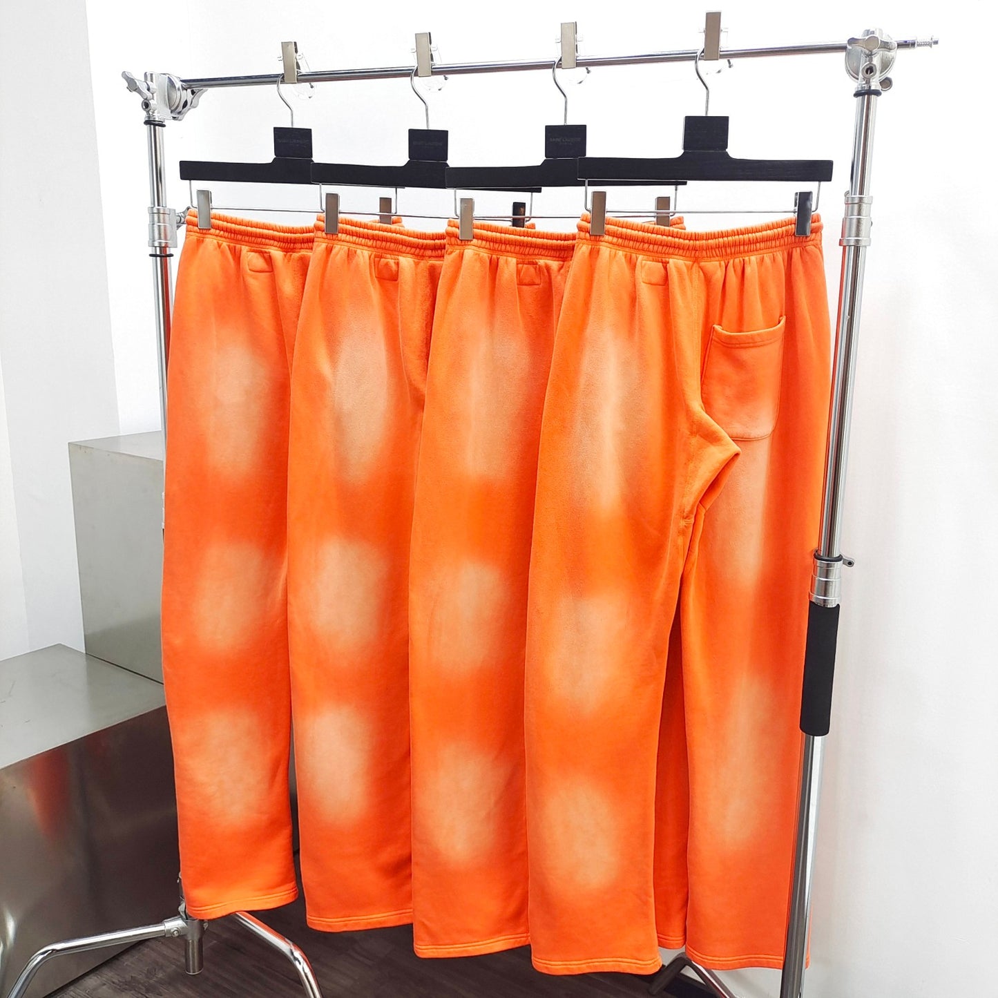 Hellstar Studios fire orange sweatpants
