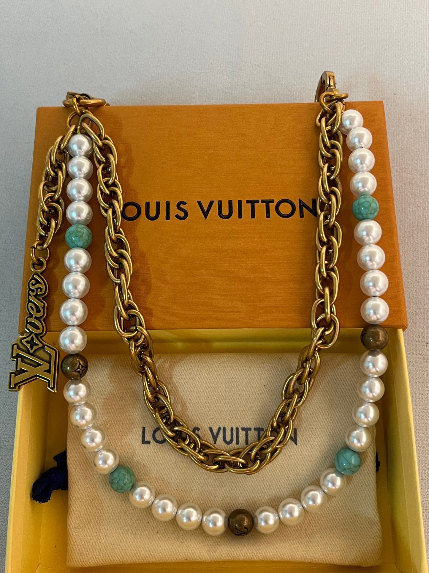 LV belt and bag charm multicolor
