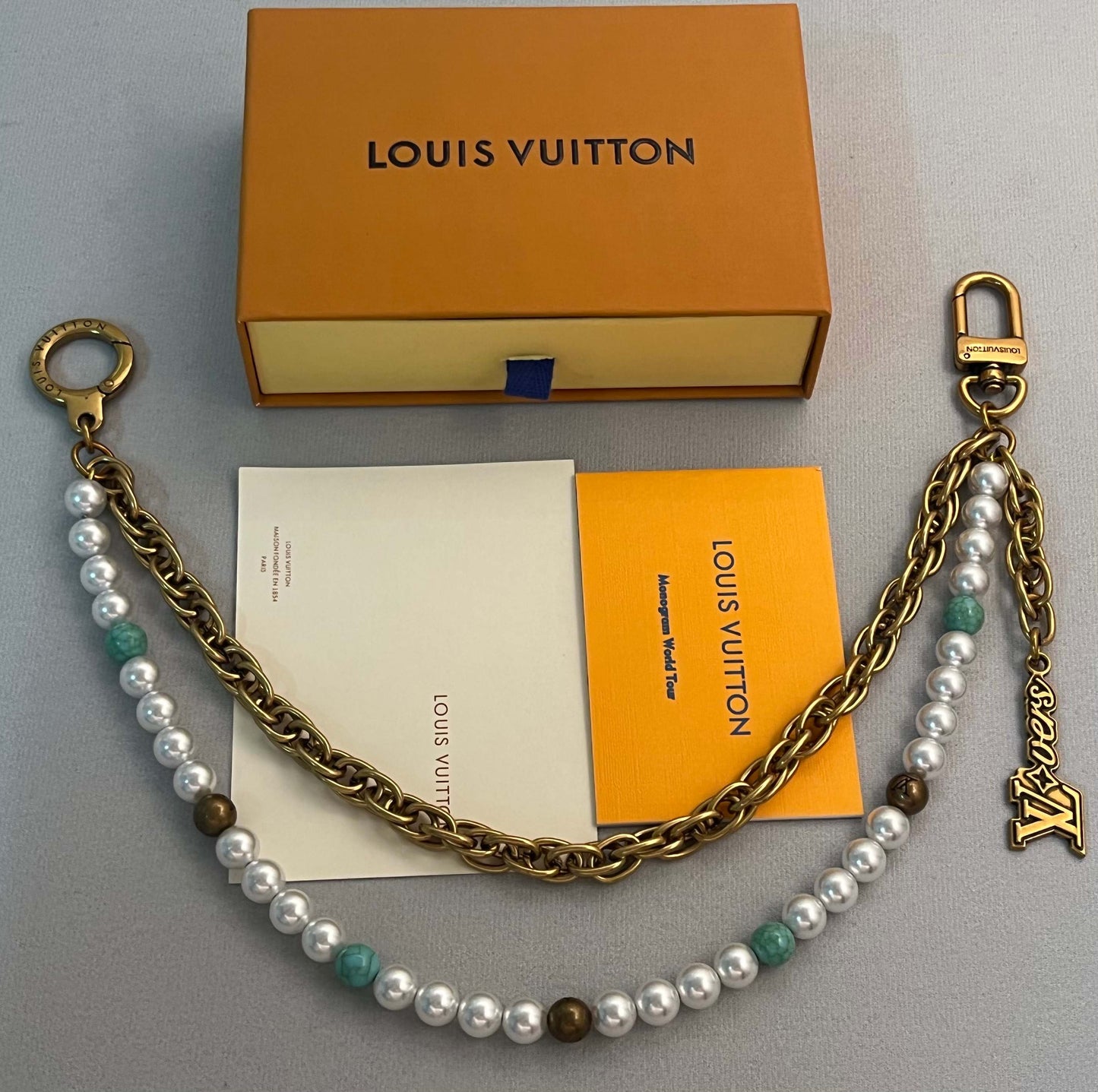 LV belt and bag charm multicolor