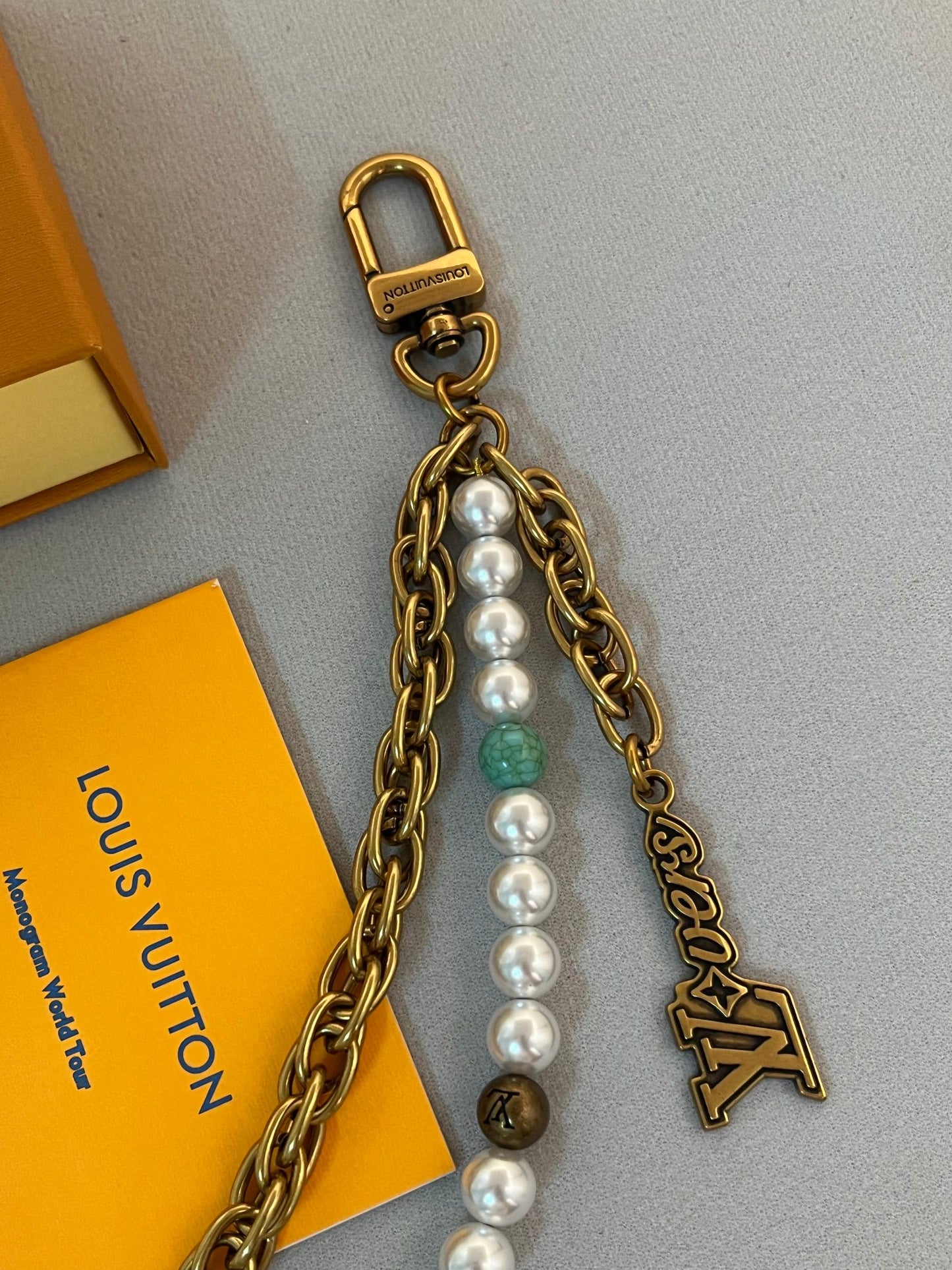 LV belt and bag charm multicolor