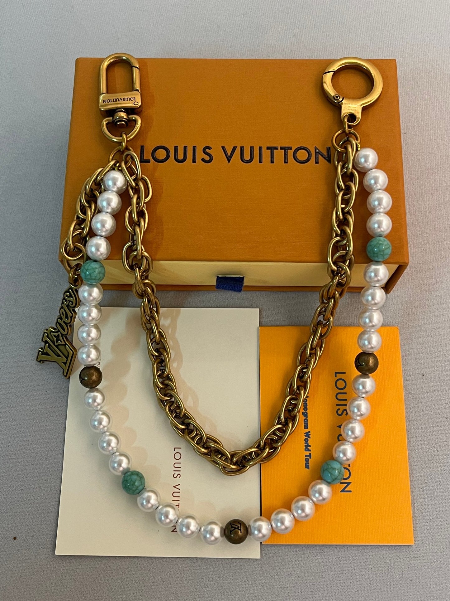 LV belt and bag charm multicolor