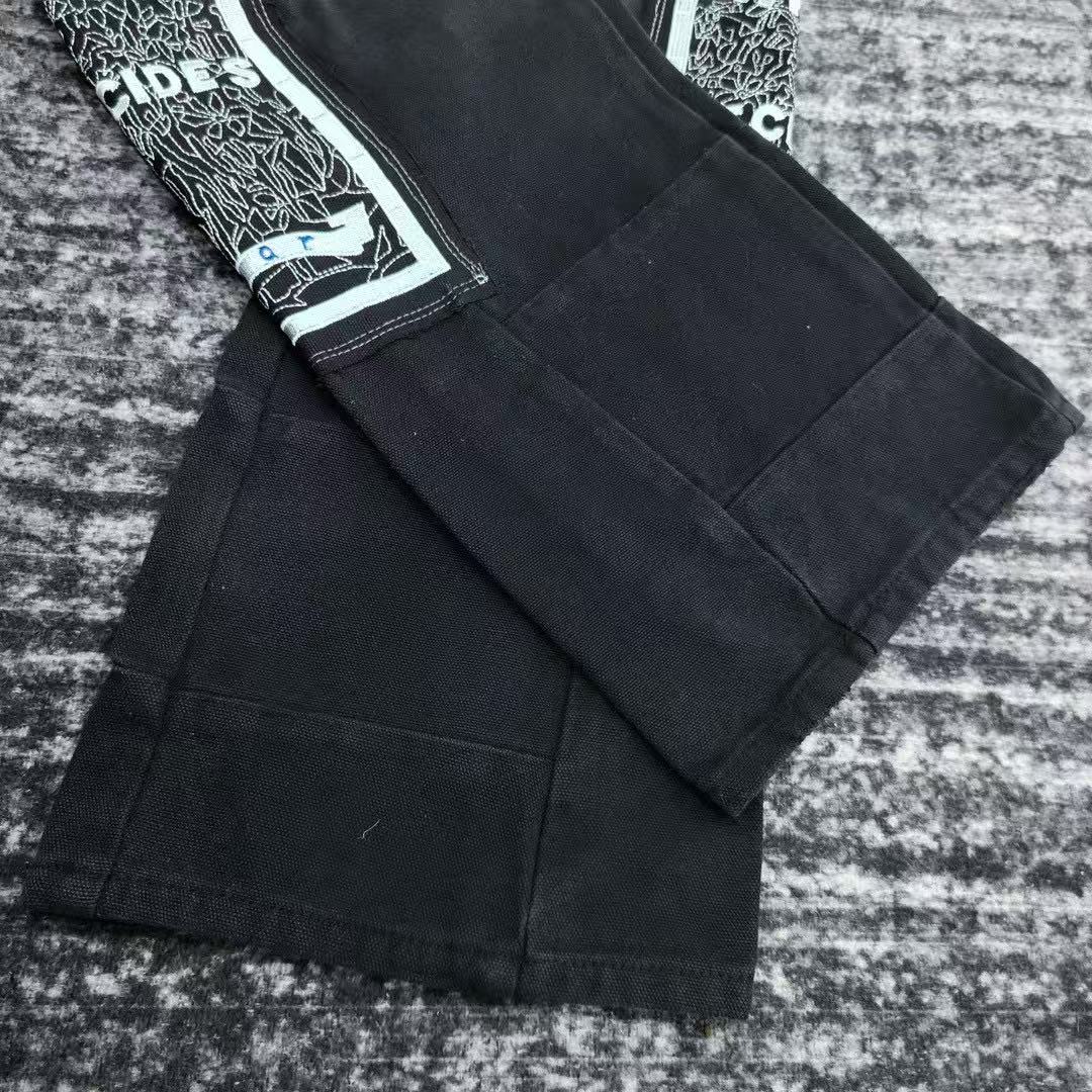 WHO DECIDES WAR EMBROIDERED PANTS