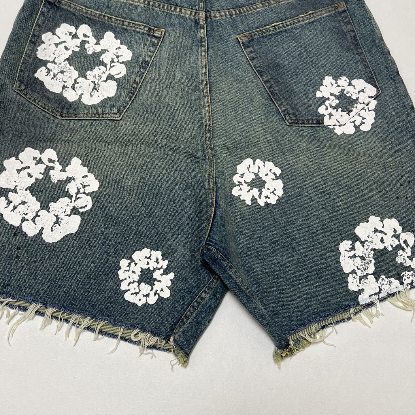 Denim Tears ripped denim shorts