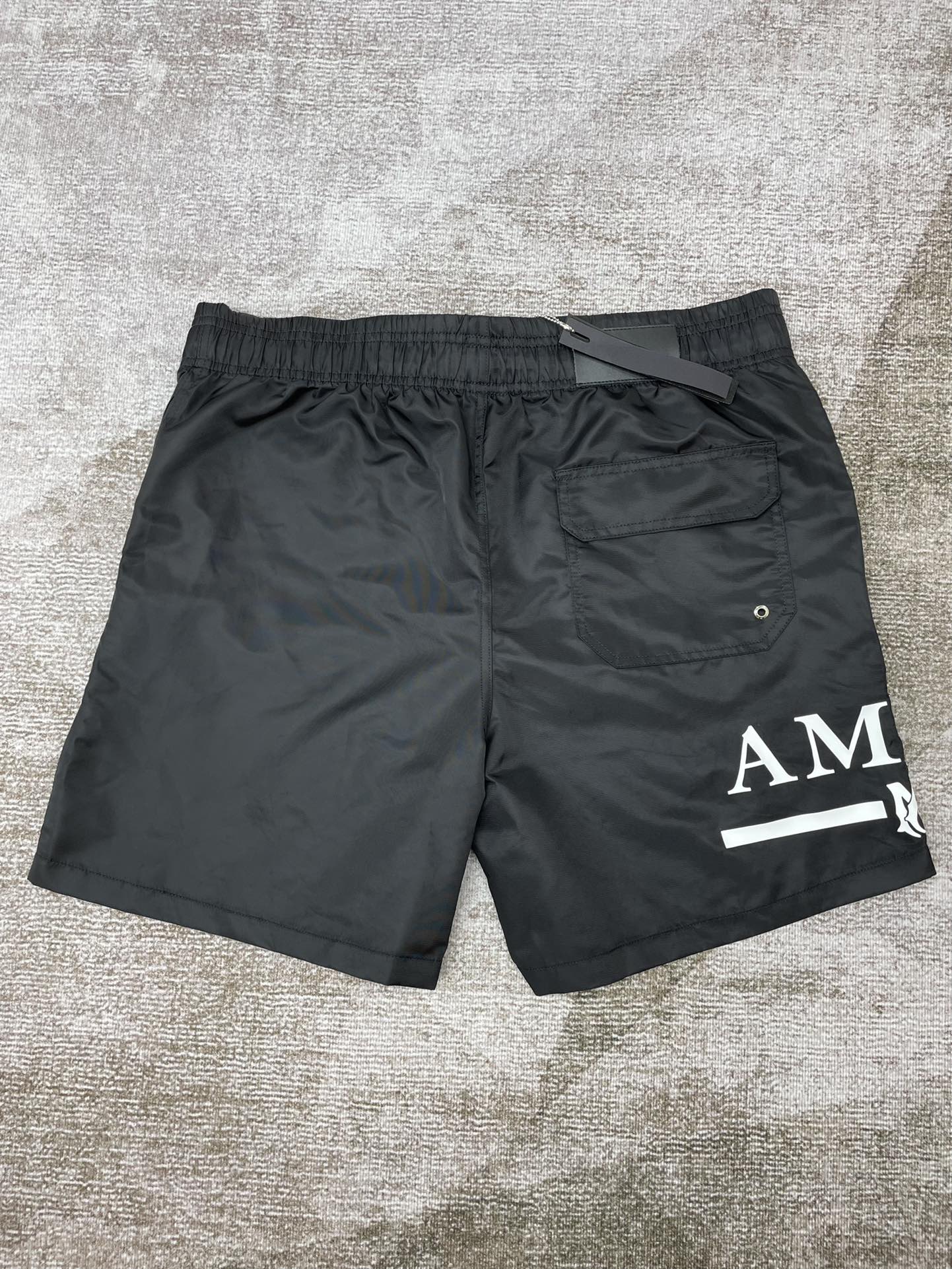Amiri core logo swim trunks