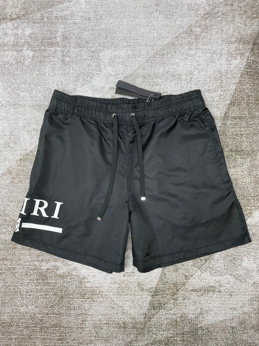 Amiri core logo swim trunks