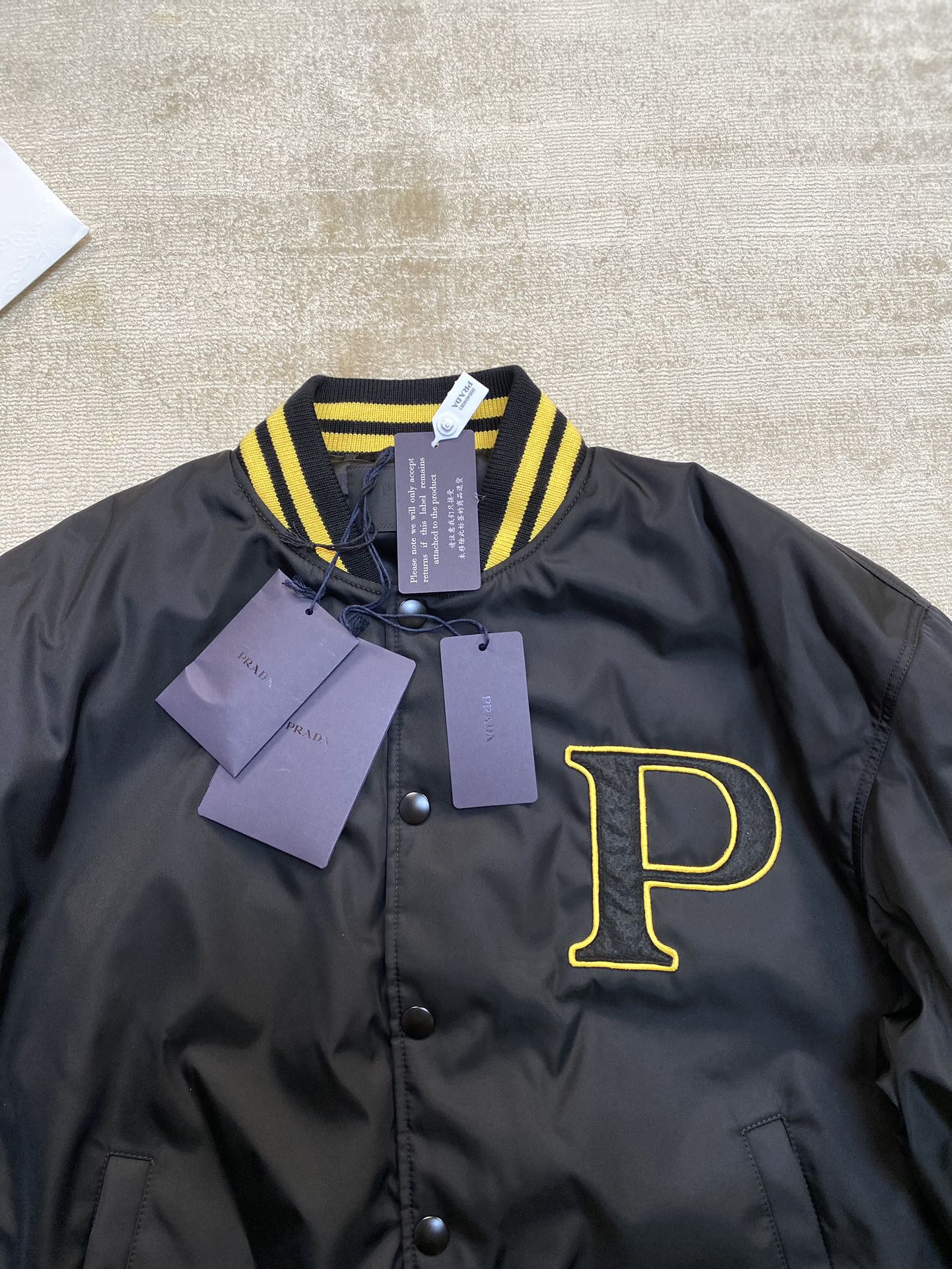 Prada Re-Nylon bomber jacket with patch