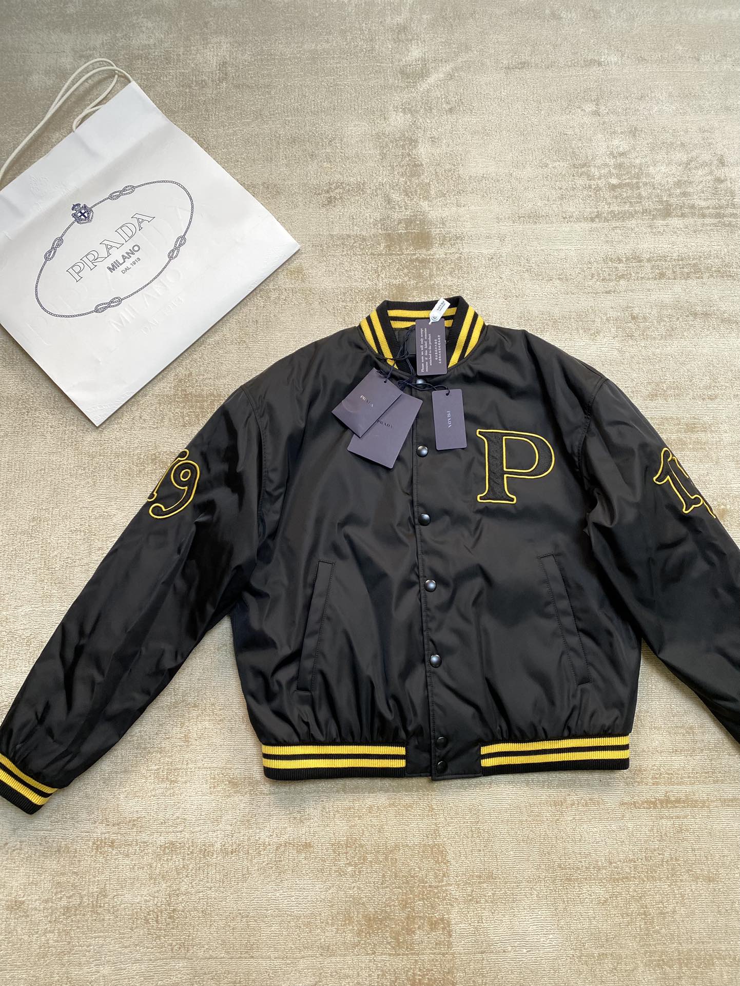 Prada Re-Nylon bomber jacket with patch