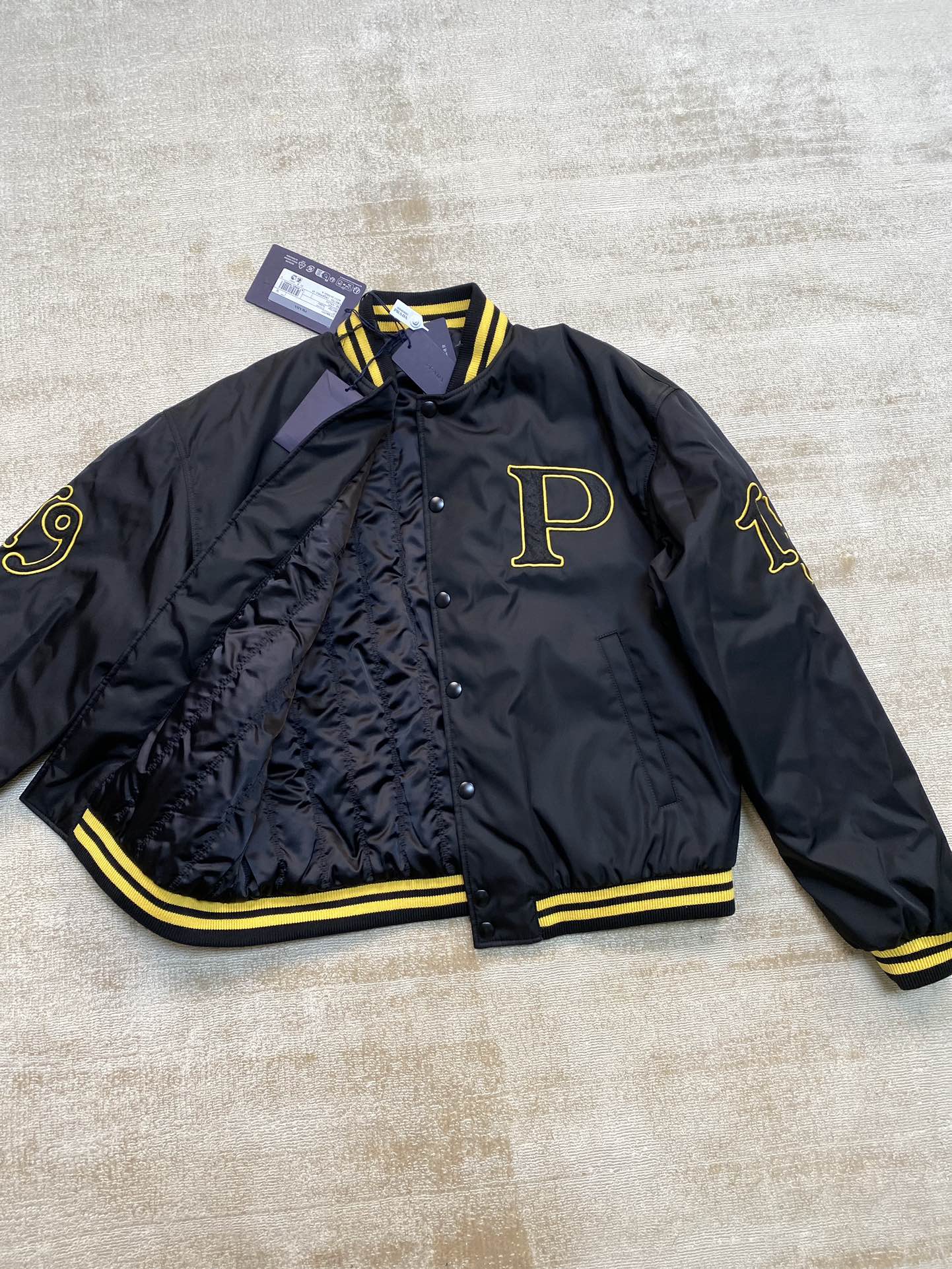 Prada Re-Nylon bomber jacket with patch